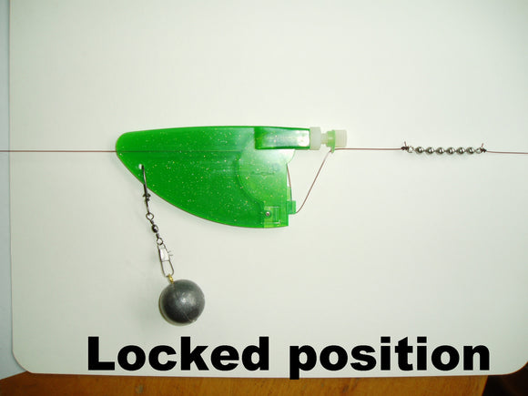 This is LongLiner in the locked position.  The weight will hang at this point until a fish is hooked and the LongLiner will then unlock into freesliding mode.  If the fish darts away at maximum speed, the line easily passes through the LongLiner reducing the shock on the line and hook.  The weight doesn't accelerate at the same rate as the fish.  