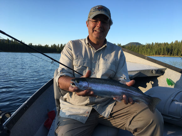 I am holding a really nice Eastern Oregon rainbow trout taken with my fly rod